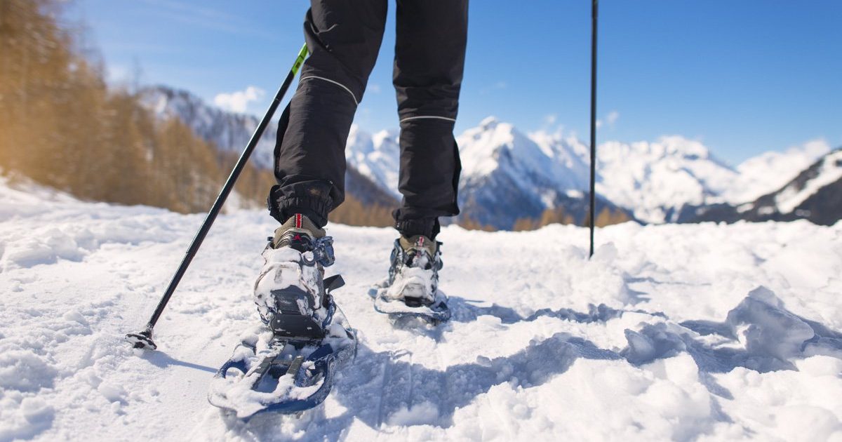 Mountain hike with snowshoes during winter holidays